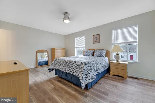 a bedroom with a bed and a dresser