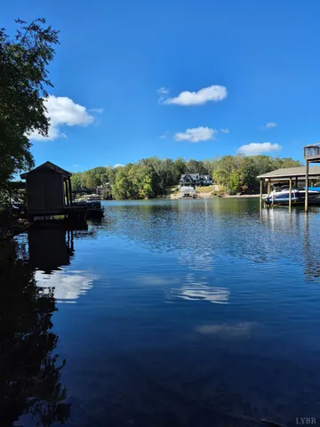a view of a lake with houses in the back