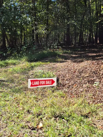 a view of a patio with a table chairs and a patio