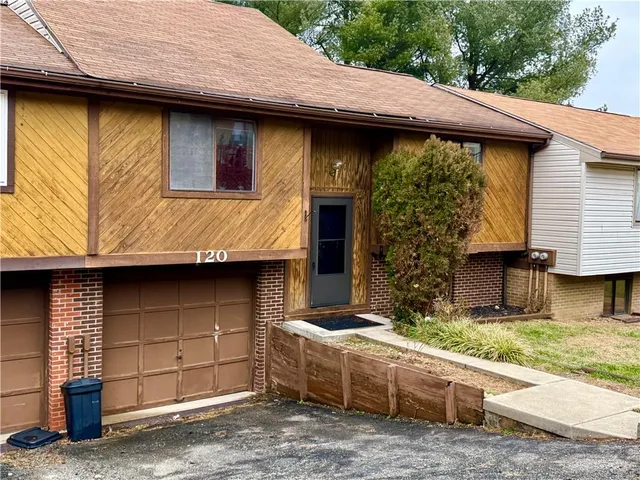 a view of a house with roof deck