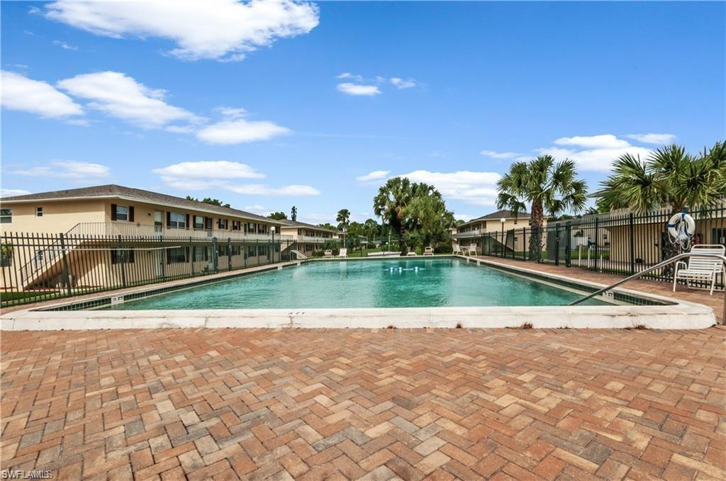 3325 Airport-Pulling Road North, Unit L1 Naples, FL 34105 - Photo 2 of 8 a view of houses with swimming pool