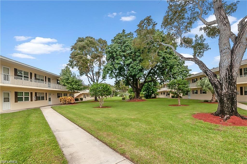 3325 Airport-Pulling Road North, Unit L1 Naples, FL 34105 - Photo 3 of 8 a view of a house with a big yard