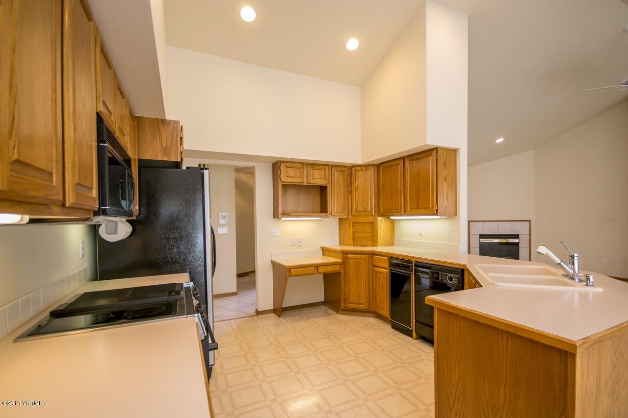11814 Marble Road Yakima, WA 98908 - Photo 5 of 15 a kitchen with a sink appliances and cabinets