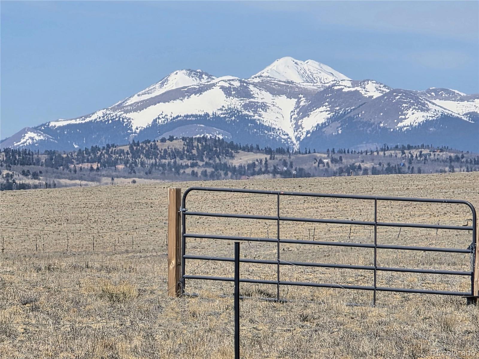 1000 Yellowstone Road Hartsel, CO 80449 - Photo 2 of 37 a view of a lake with a mountain in the background