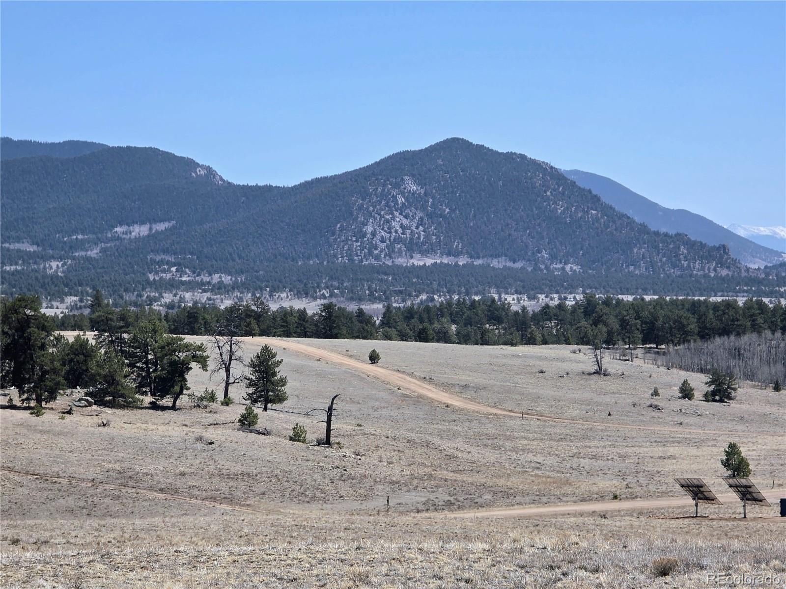 1000 Yellowstone Road Hartsel, CO 80449 - Photo 25 of 37 a view of a town with mountains in the background