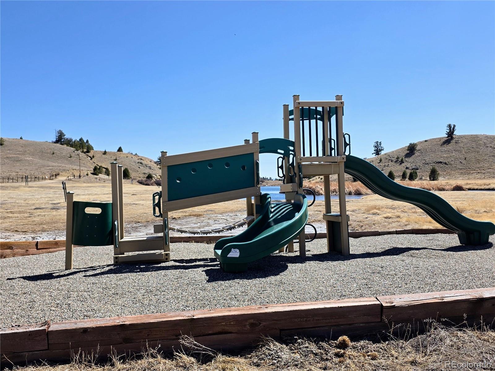 1000 Yellowstone Road Hartsel, CO 80449 - Photo 32 of 37 a view of a roof deck with wooden fence and a floor
