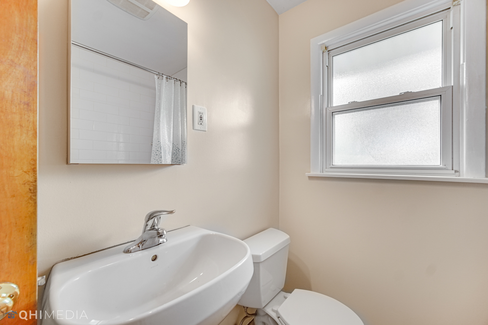 1401 Birch Road Homewood, IL 60430 - Photo 13 of 22 a bathroom with a sink mirror and toilet