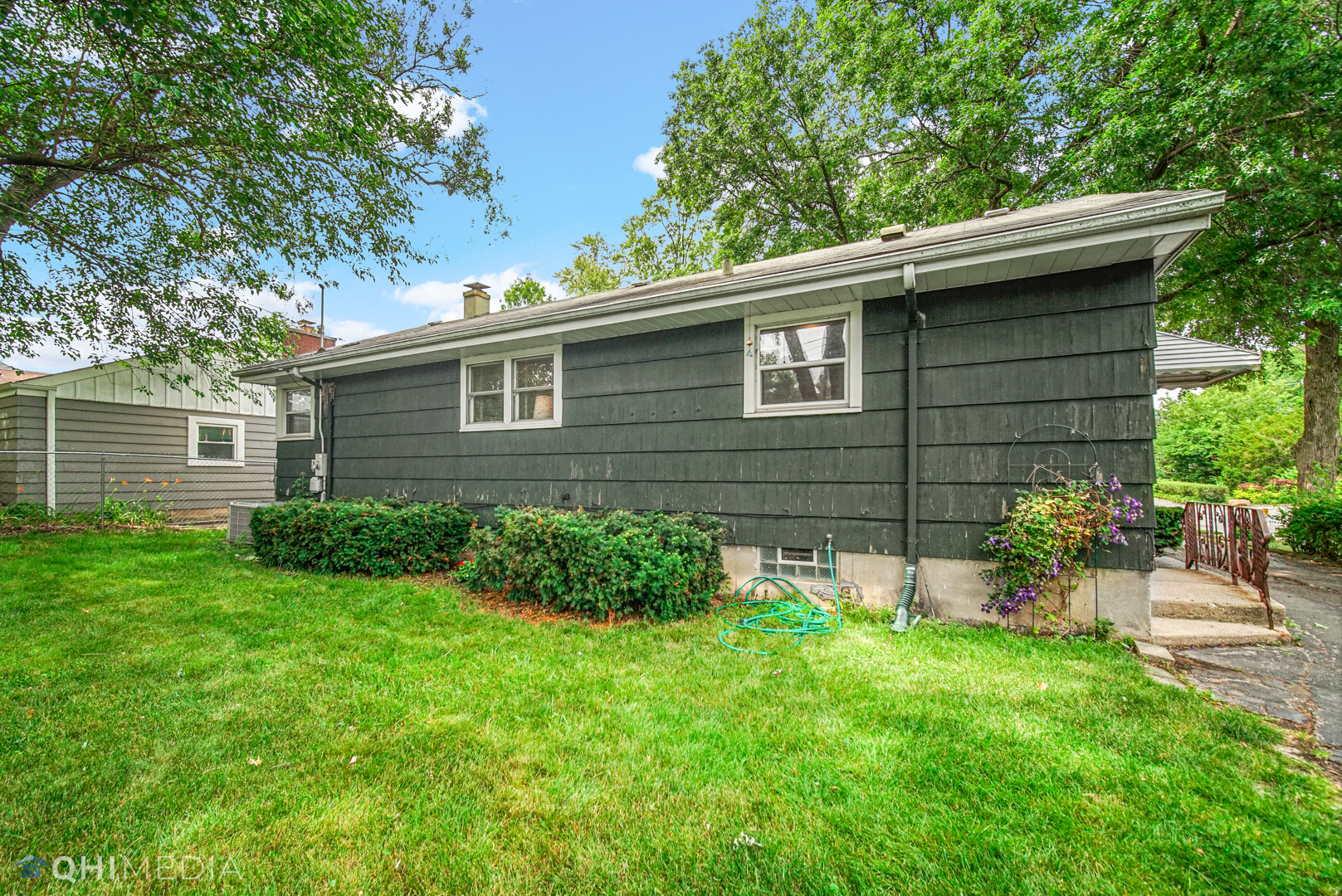 1401 Birch Road Homewood, IL 60430 - Photo 21 of 22 a view of a backyard with plants and large tree