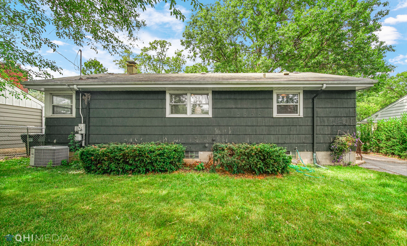1401 Birch Road Homewood, IL 60430 - Photo 22 of 22 a front view of a house with a garden
