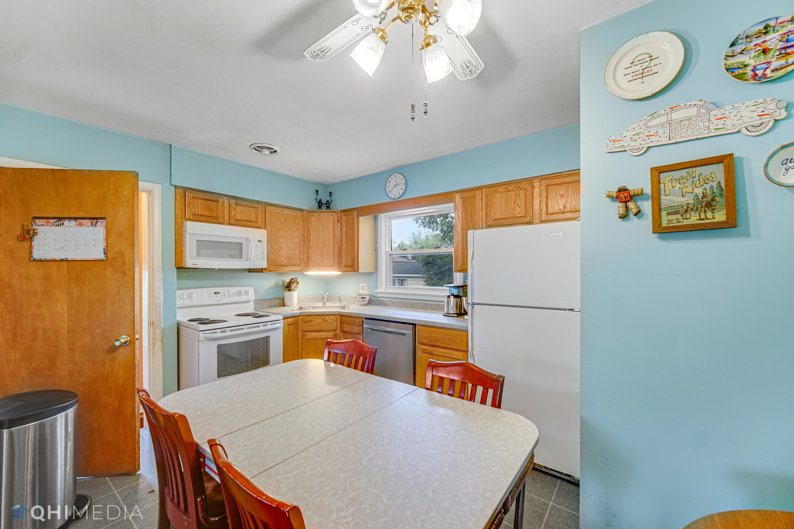 1401 Birch Road Homewood, IL 60430 - Photo 6 of 22 a kitchen with a refrigerator a stove a sink and a dining table