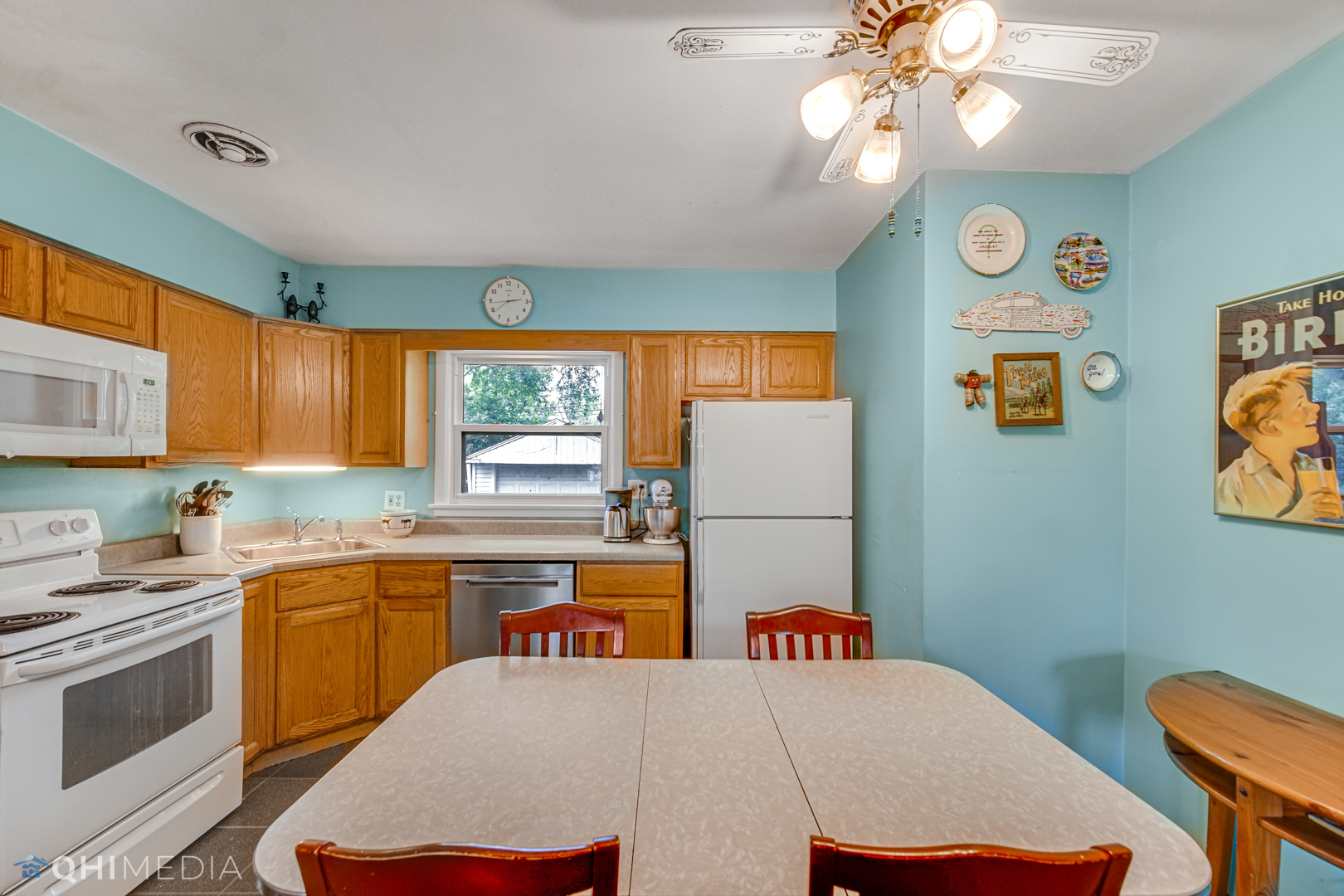 1401 Birch Road Homewood, IL 60430 - Photo 8 of 22 a kitchen that has a microwave a sink and a stove in it