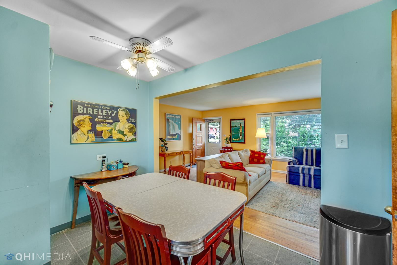1401 Birch Road Homewood, IL 60430 - Photo 9 of 22 a dining room with furniture a flat screen tv and a large window