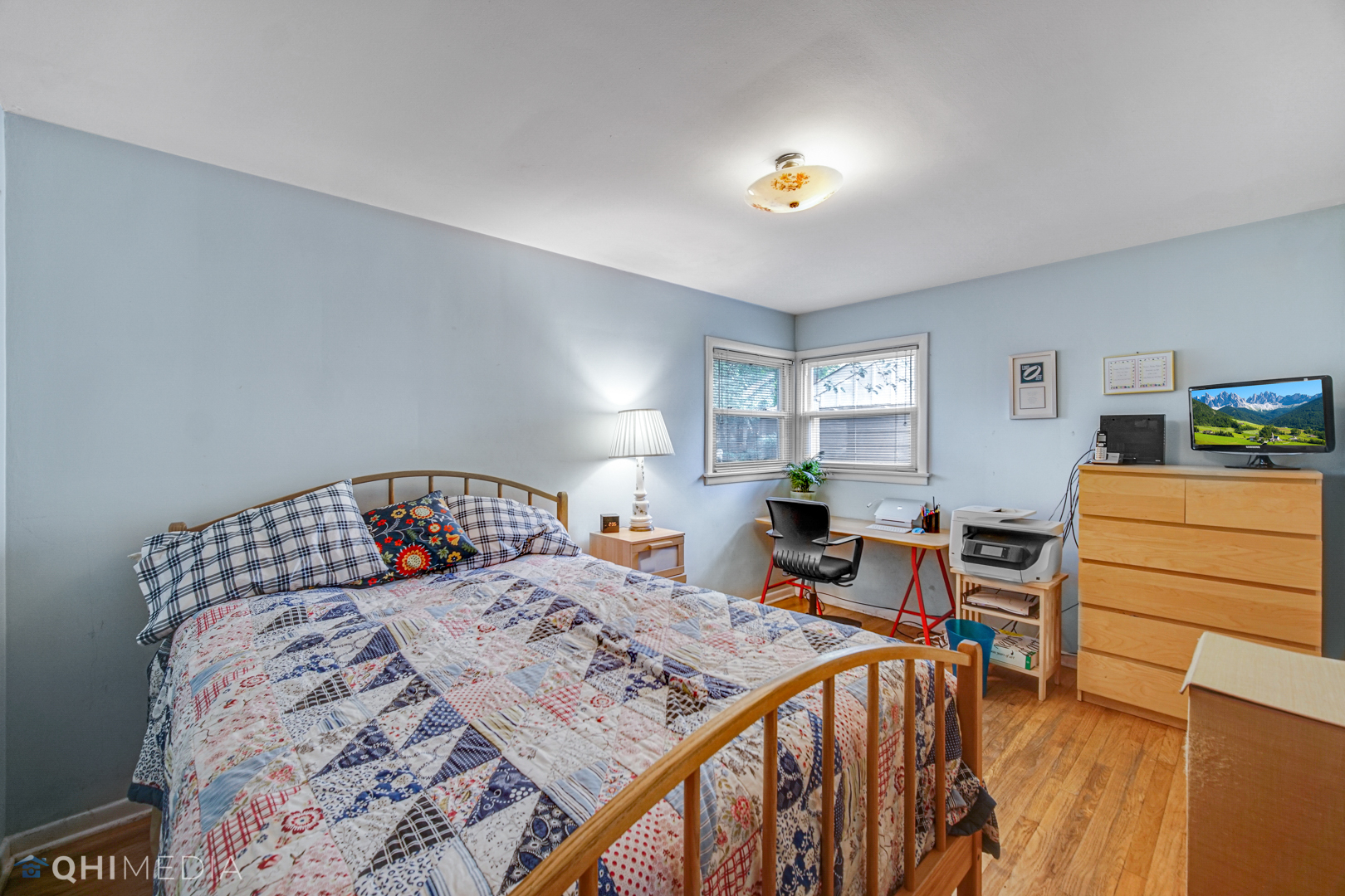 1401 Birch Road Homewood, IL 60430 - Photo 10 of 22 a bedroom with a bed and wooden floor