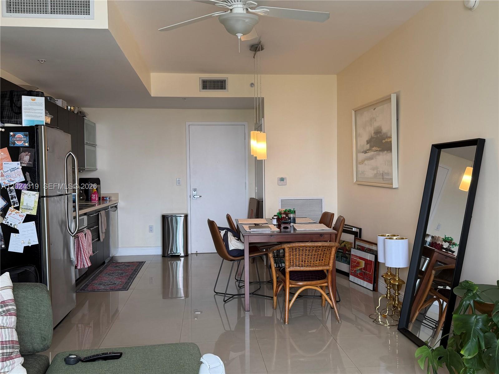 90 Southwest 3rd Street, Unit 1409 Miami, FL 33130 - Photo 9 of 25 a view of a dining room with furniture
