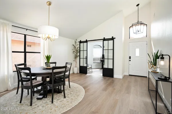 a view of a dining room with furniture window and wooden floor