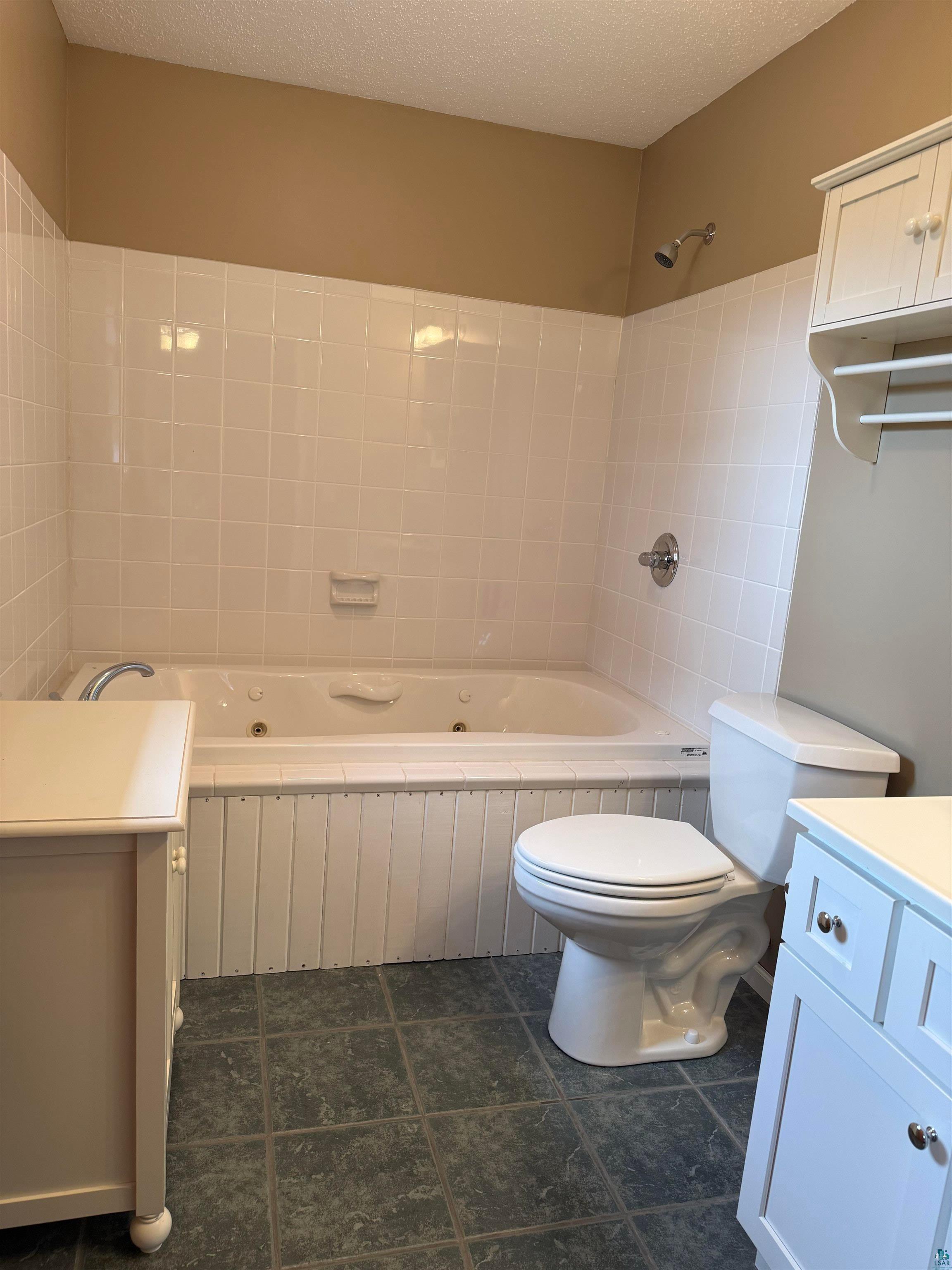 5080 Tower Road Moose Lake, MN 55767 - Photo 21 of 49 White tiled shower and tub combination