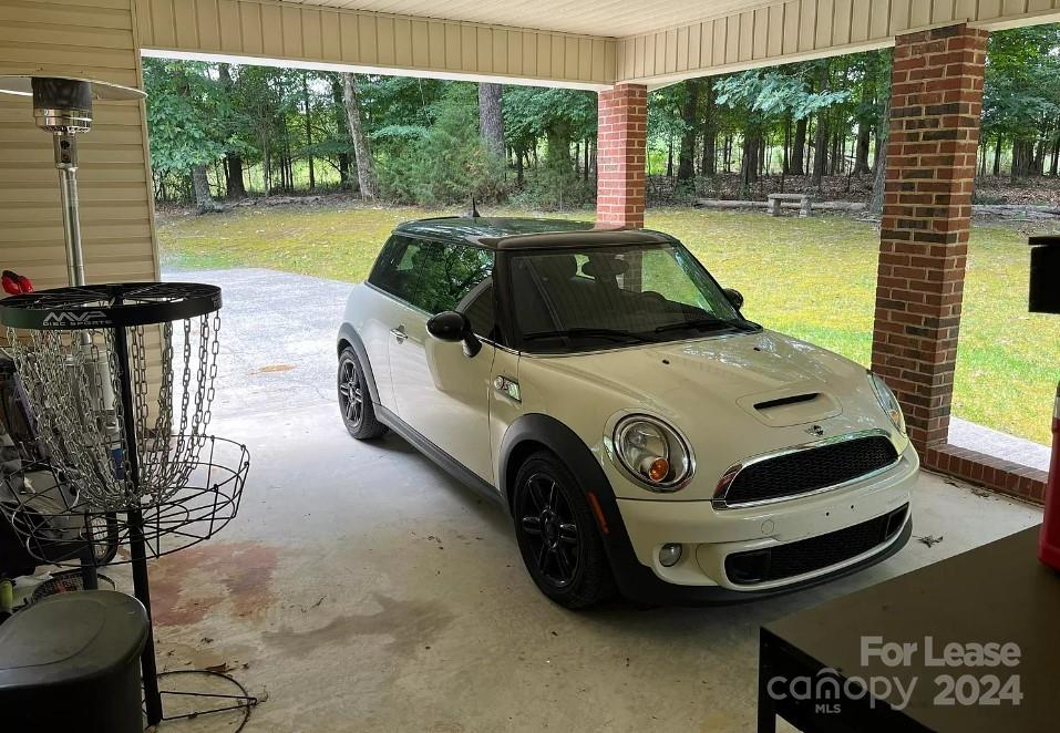 2414 Providence Road South Waxhaw, NC 28173 - Photo 13 of 15 a car parked in front of a brick house