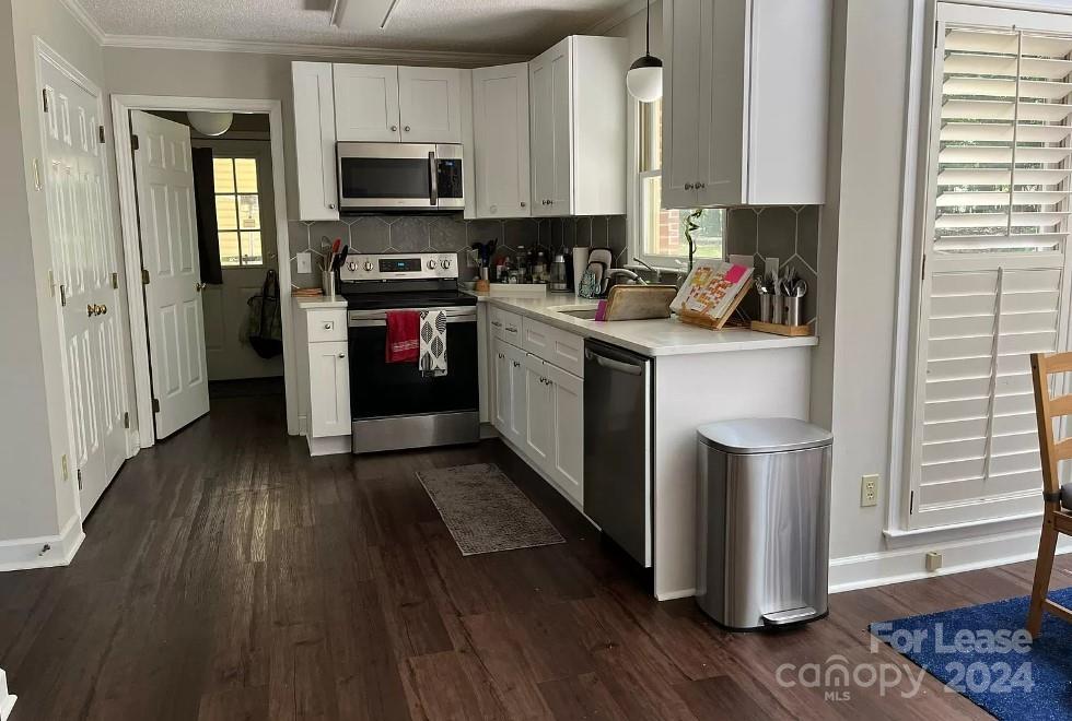 2414 Providence Road South Waxhaw, NC 28173 - Photo 6 of 15 a kitchen with stainless steel appliances granite countertop a stove a sink and a refrigerator