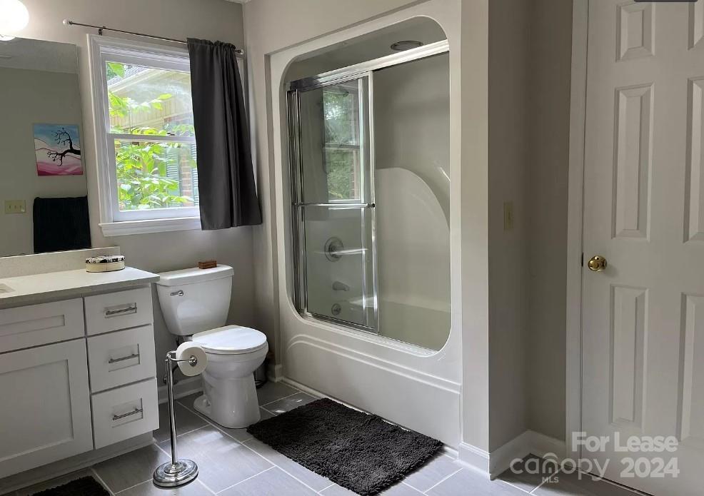 2414 Providence Road South Waxhaw, NC 28173 - Photo 10 of 15 a bathroom with a toilet a sink and a window