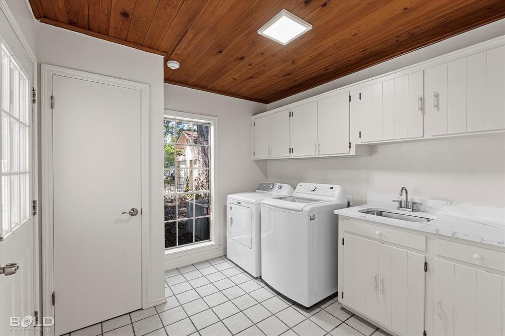 5800 Jefferson Paige Road Shreveport, LA 71119 - Photo 23 of 39 a view of a storage & utility room with dryer and washer