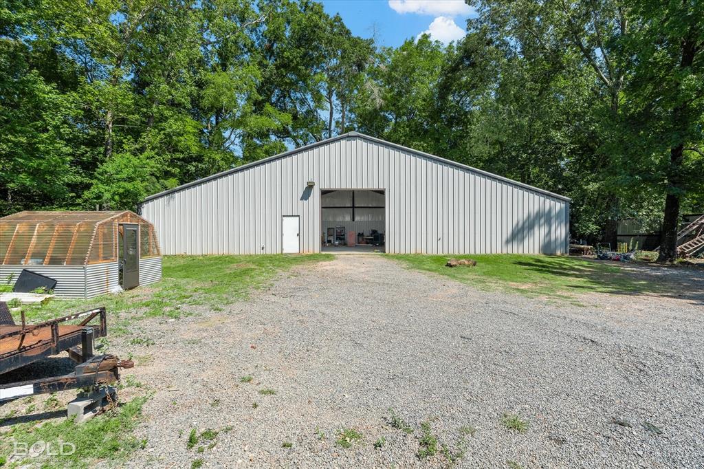 5800 Jefferson Paige Road Shreveport, LA 71119 - Photo 26 of 39 a view of a house with backyard and garden