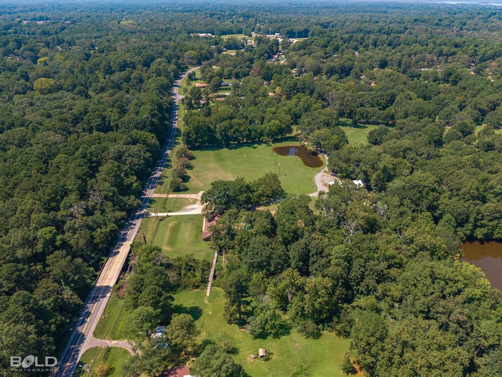 5800 Jefferson Paige Road Shreveport, LA 71119 - Photo 37 of 39 an aerial view of residential house with outdoor space and trees all around