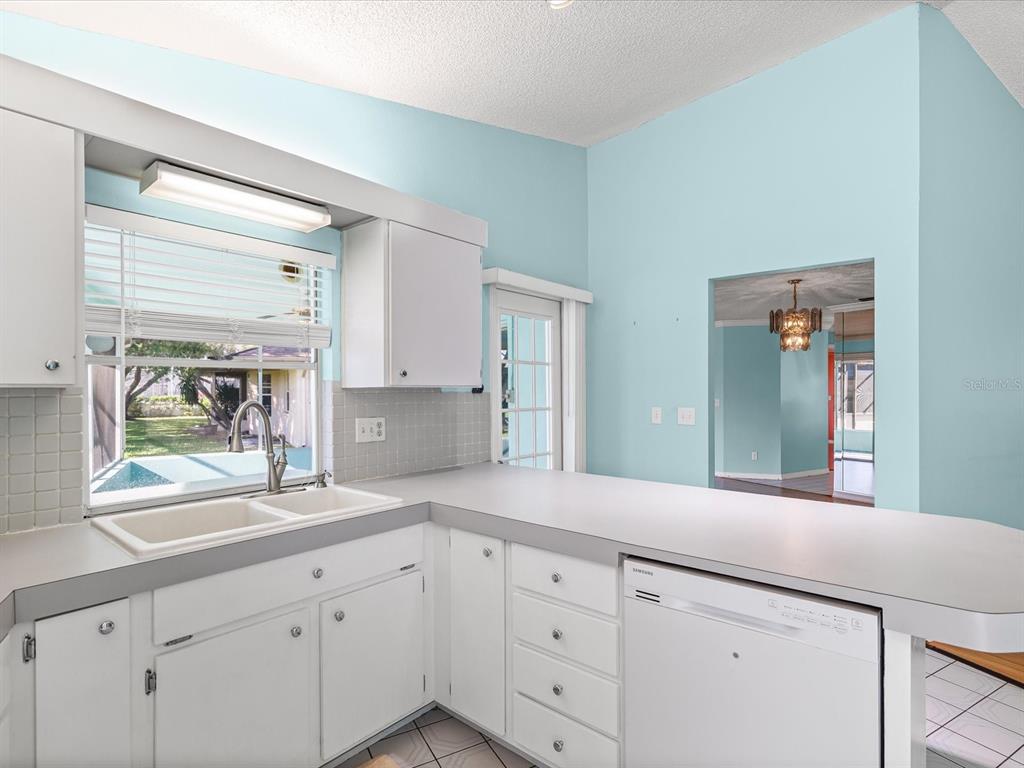 5853 Redhawk Drive New Port Richey, FL 34655 - Photo 12 of 38 a spacious bathroom with double vanity a mirror and a window