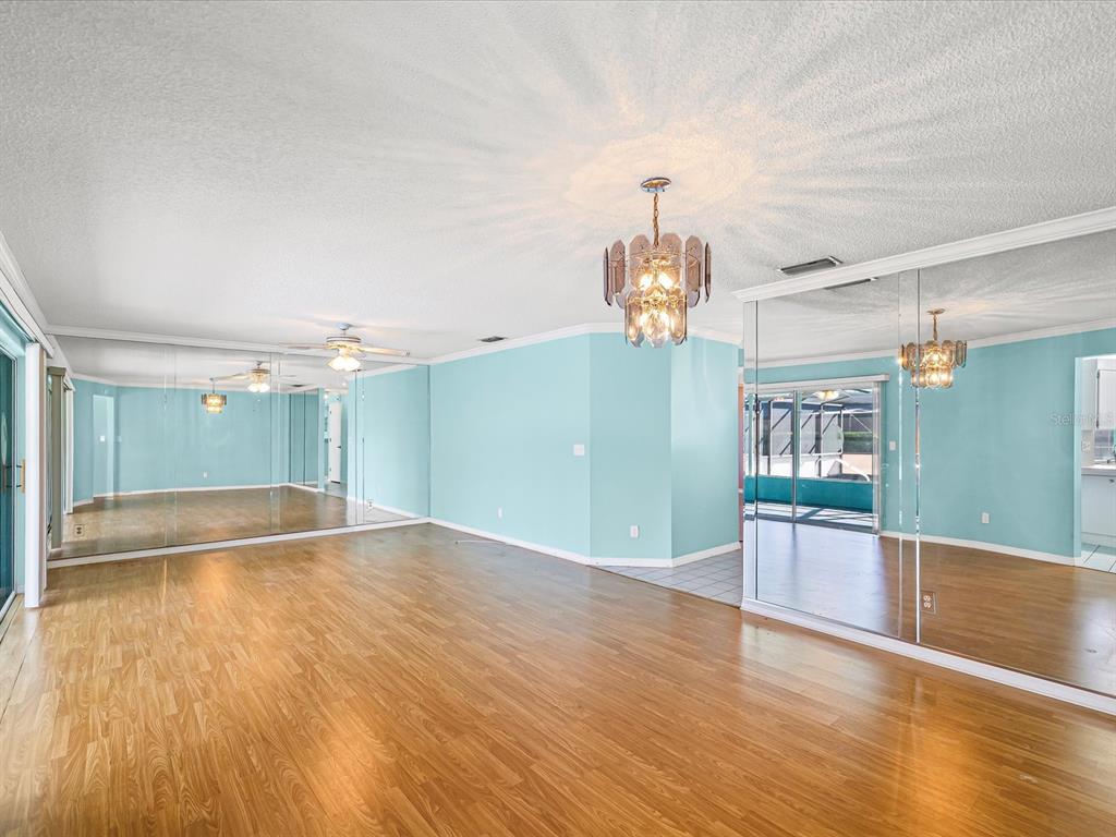 5853 Redhawk Drive New Port Richey, FL 34655 - Photo 17 of 38 a view of empty room with wooden floor