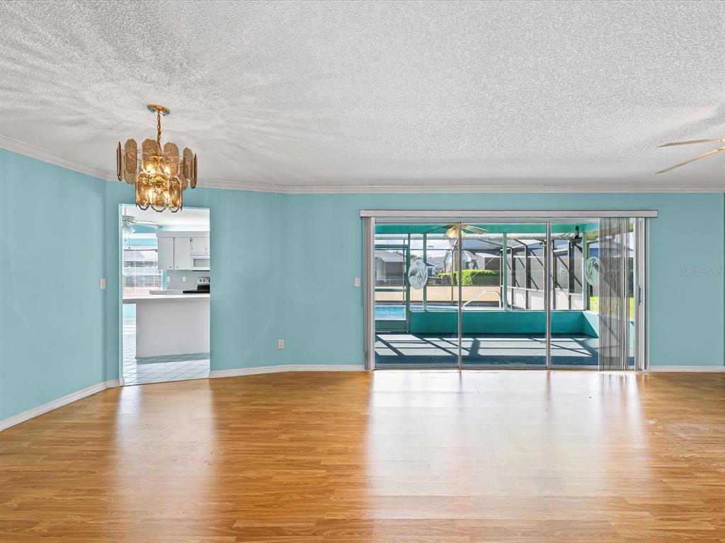5853 Redhawk Drive New Port Richey, FL 34655 - Photo 19 of 38 a view of a livingroom with wooden floor