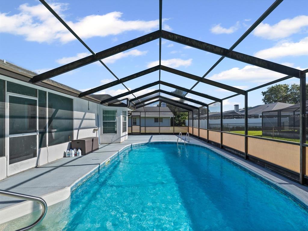 5853 Redhawk Drive New Port Richey, FL 34655 - Photo 2 of 38 a view of swimming pool with yard