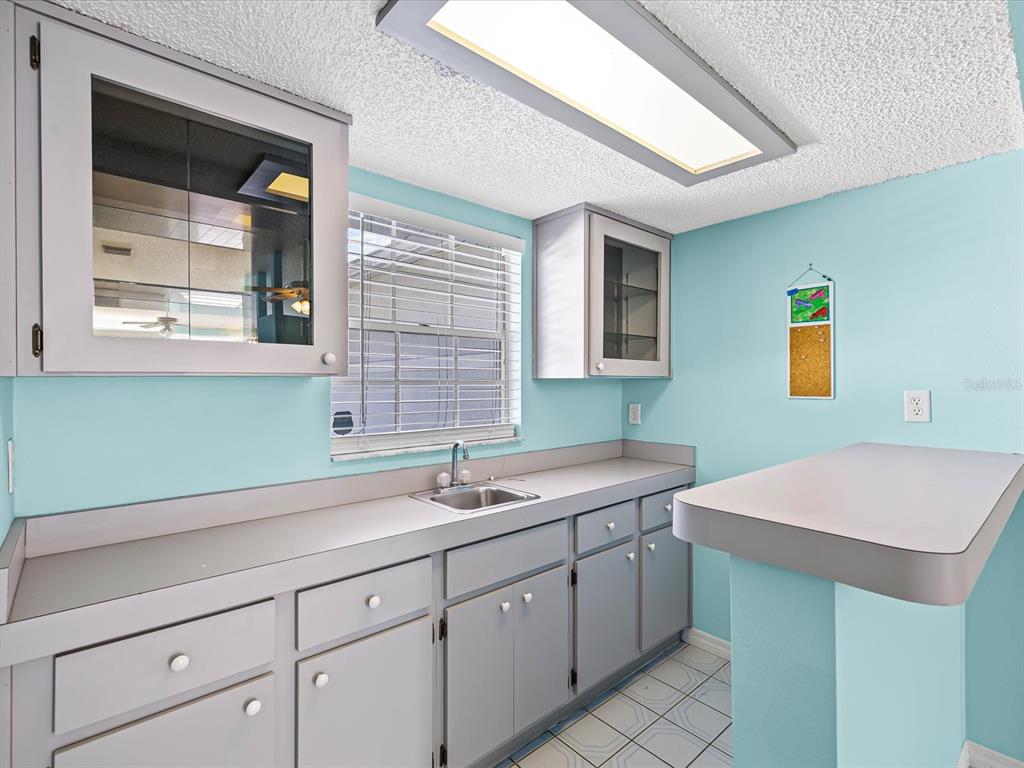 5853 Redhawk Drive New Port Richey, FL 34655 - Photo 21 of 38 a kitchen with a sink and cabinets