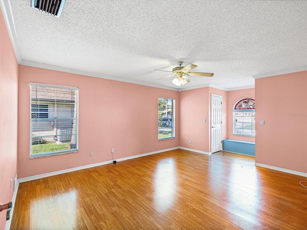 5853 Redhawk Drive New Port Richey, FL 34655 - Photo 25 of 38 wooden floor in an empty room with a window