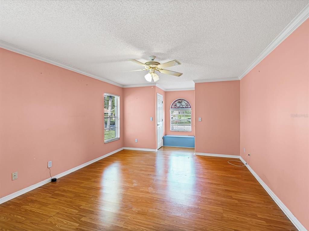 5853 Redhawk Drive New Port Richey, FL 34655 - Photo 26 of 38 a view of an empty room with window and wooden floor