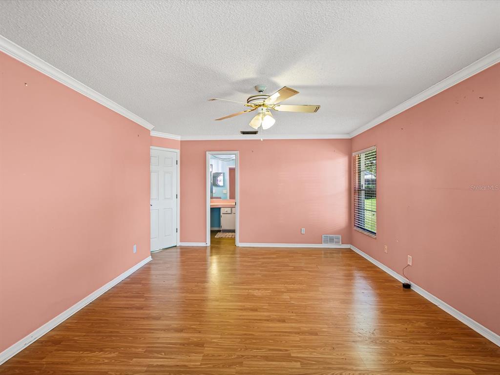 5853 Redhawk Drive New Port Richey, FL 34655 - Photo 28 of 38 a view of an empty room with window and wooden floor