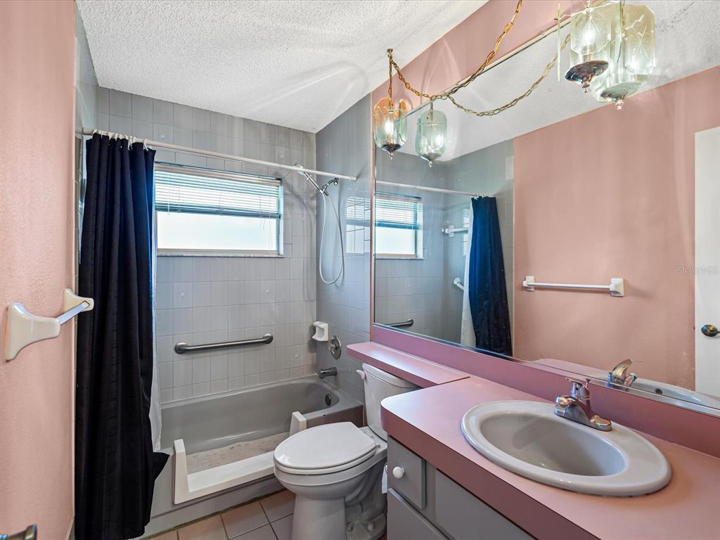 5853 Redhawk Drive New Port Richey, FL 34655 - Photo 31 of 38 a bathroom with a sink toilet and shower