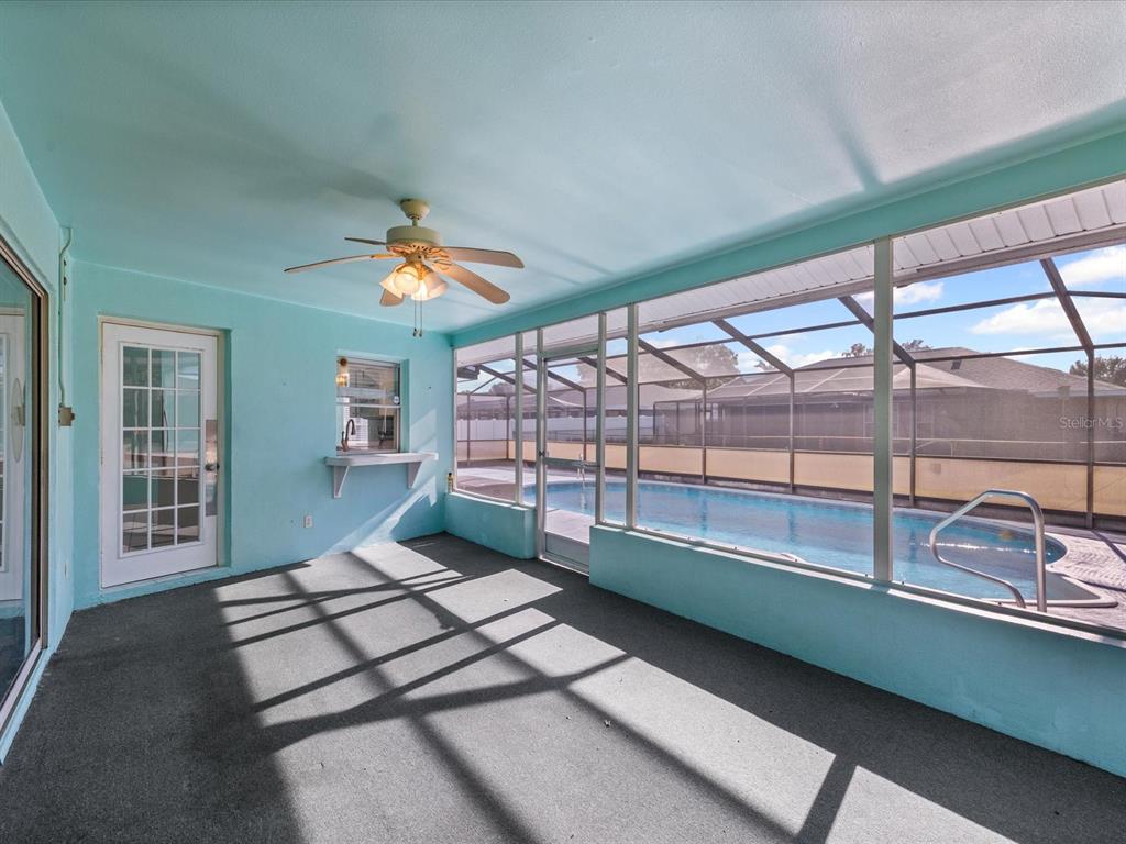 5853 Redhawk Drive New Port Richey, FL 34655 - Photo 7 of 38 a living room with a large window