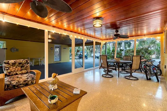 a view of a patio with a table and chairs