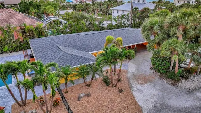 an aerial view of a house with a garden