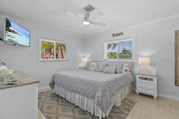a bedroom with a bed and a table