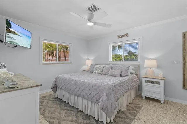 a bedroom with a bed and a table