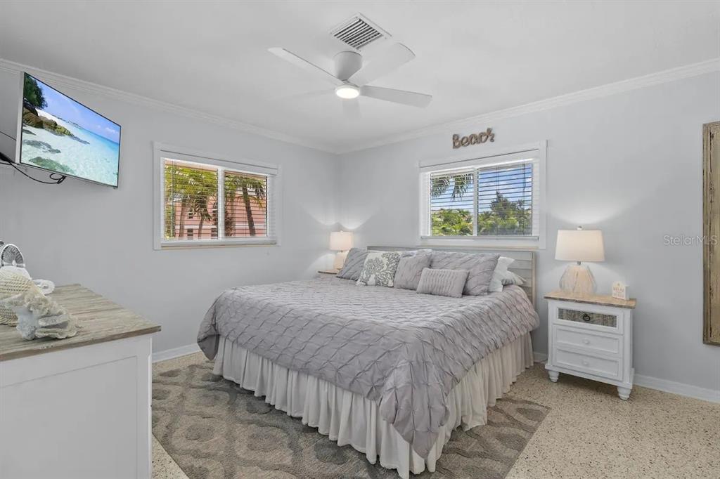 2795 North Beach Road, Unit A Englewood, FL 34223 - Photo 23 of 53 a bedroom with a bed and a table