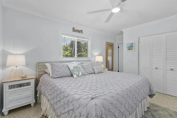 a bed room with a bed and a night stand