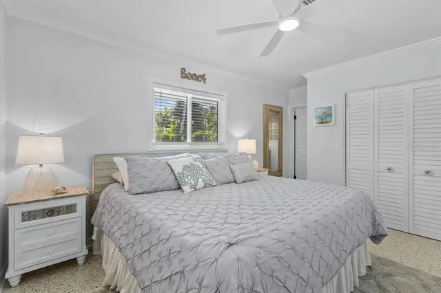 a bed room with a bed and a night stand