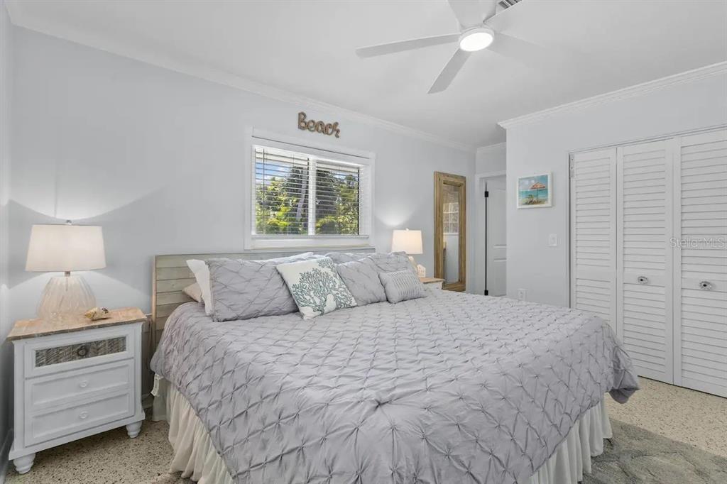 2795 North Beach Road, Unit A Englewood, FL 34223 - Photo 24 of 53 a bed room with a bed and a night stand