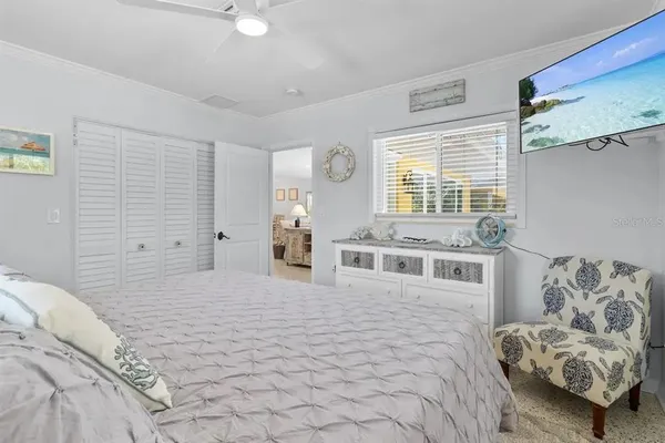 a bedroom with a bed and a couch