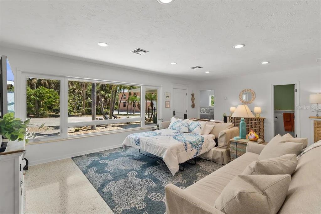 2795 North Beach Road, Unit A Englewood, FL 34223 - Photo 33 of 53 a living room with furniture and a large window