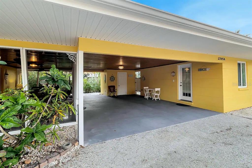 2795 North Beach Road, Unit A Englewood, FL 34223 - Photo 35 of 53 a view of a car garage door