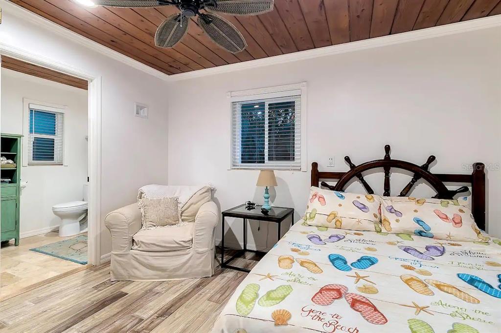 2795 North Beach Road, Unit A Englewood, FL 34223 - Photo 38 of 53 a bedroom with bed and a window