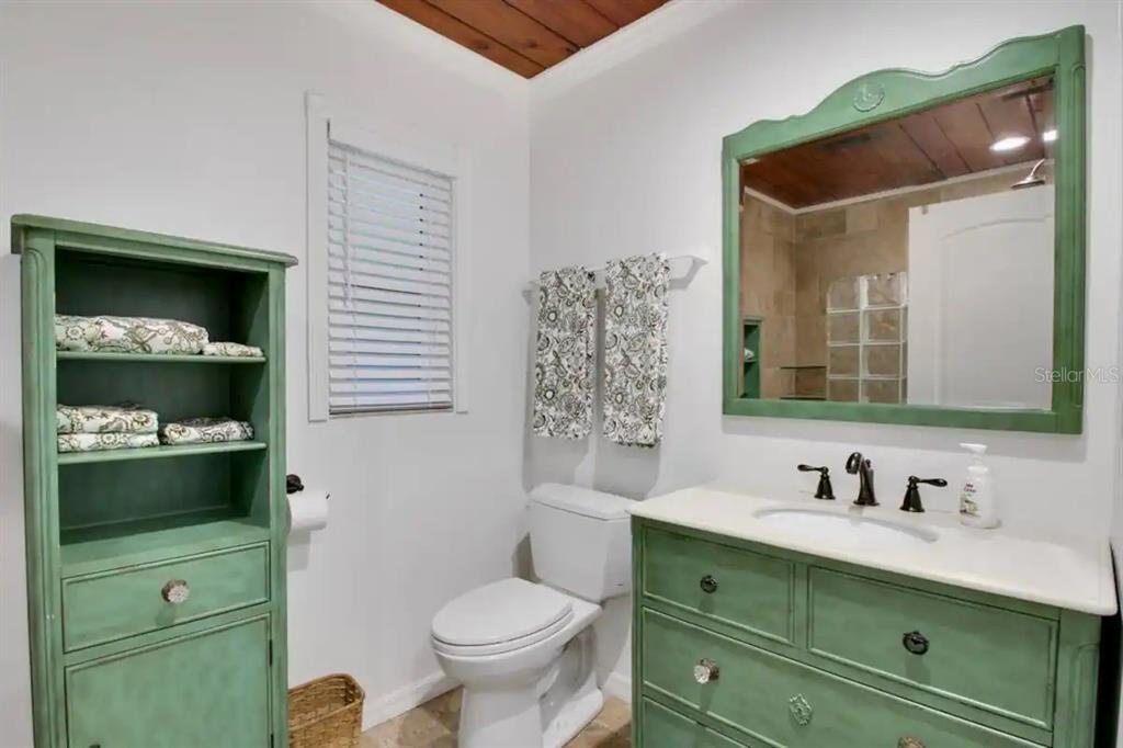 2795 North Beach Road, Unit A Englewood, FL 34223 - Photo 39 of 53 a bathroom with a sink vanity and toilet