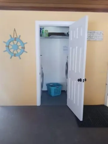 an outdoor space with furniture and lake view